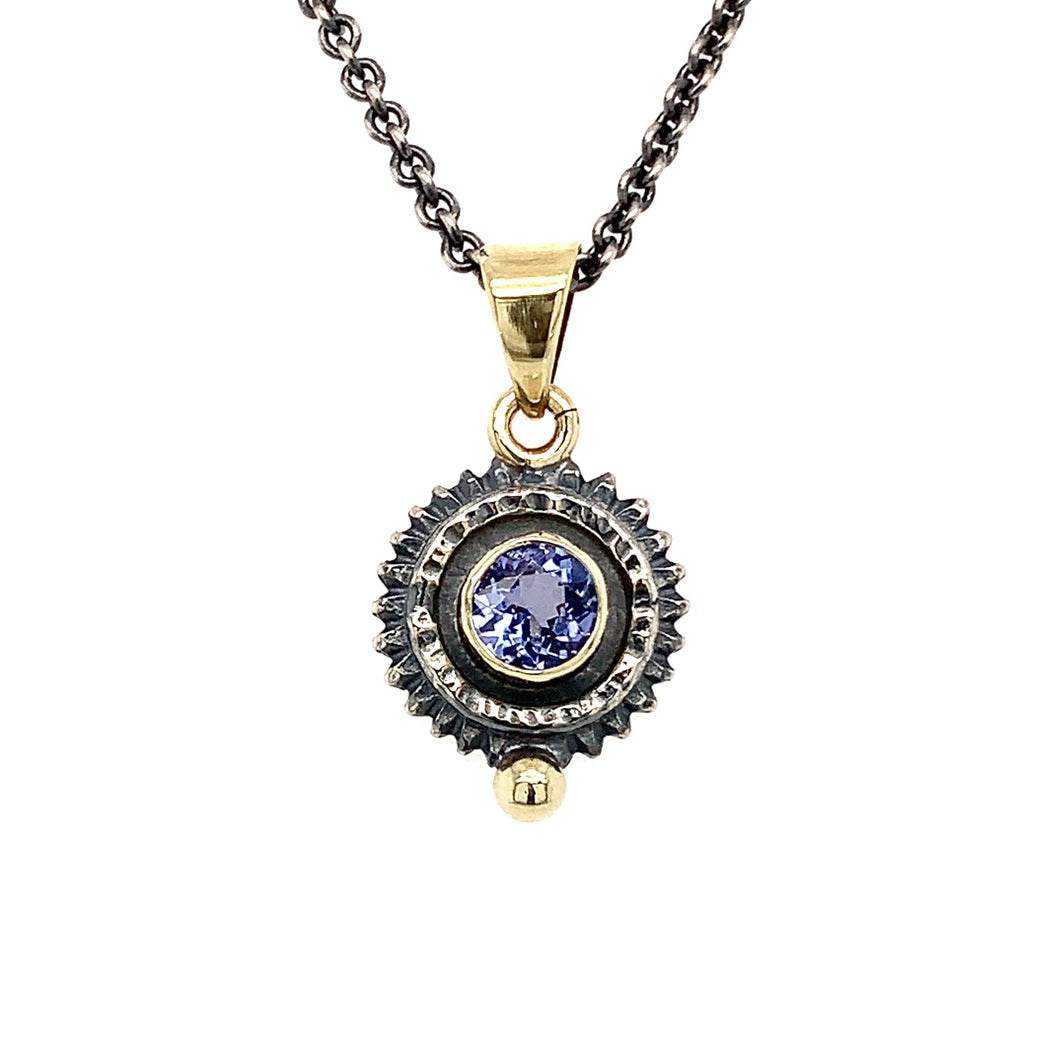 “She’s Getting Into High Gear” - Tanzanite 14K Gold & Silver Pendant